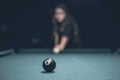 8-Ball with girl in background Royalty Free Stock Photo