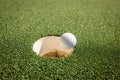 A picture showing a hole in one. Royalty Free Stock Photo