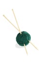Ball of green thread and knitting spokes Royalty Free Stock Photo
