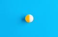 Ball halved into two different colors on blue background. Dissociative identity disorder