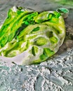 A ball of handmade sugar paste placed on a marbled worktop