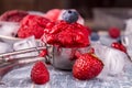 Ball of homemade strawberry, red currant, raspberry, blueberry ice cream, sorbet.in scoop. berries over on wooden background. Royalty Free Stock Photo