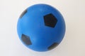 Ball isolated on white background. A plastic ball for kids. Blue and black soccer ball.