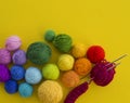 Ball for knit rainbow color a yellow background. Royalty Free Stock Photo