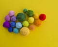 Ball for knit rainbow color a yellow background. Royalty Free Stock Photo