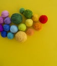 Ball for knit rainbow color a yellow background. Royalty Free Stock Photo