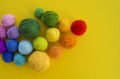 Ball for knit rainbow color a yellow background. Royalty Free Stock Photo