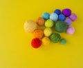 Ball for knit rainbow color a yellow background. Royalty Free Stock Photo