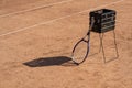 Ball machine for tennis. Professional robot for training experienced tennis players standing on court. Box prepared to Royalty Free Stock Photo