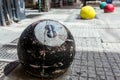 An 8-ball made of concrete.