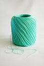 Ball of mint green yarn, on white background. Royalty Free Stock Photo