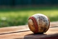 ball and mitt laying on a dirt field. possibly for baseball or softball, typical shape used for hand protection during g Royalty Free Stock Photo