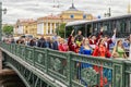 Ball of Nationalities festival participants are passing to the point of the performance over the Dvortsoviy bridge.