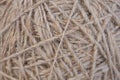 Ball of natural unpainted wool handmade closeup. Light brown or beige background or wallpaper. Handicraft, knitting and hobbies. Royalty Free Stock Photo