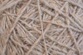 Ball of natural unpainted wool handmade closeup. Light brown or beige background or wallpaper. Handicraft, knitting and hobbies. Royalty Free Stock Photo