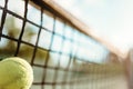 Ball in net closeup, big tennis concept Royalty Free Stock Photo