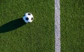 The ball next to the end line of the green football field Royalty Free Stock Photo