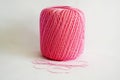 Ball of pink yarn, on white background. Royalty Free Stock Photo