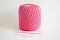 Ball of pink yarn, on white background. Royalty Free Stock Photo