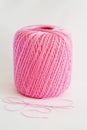 Ball of pink yarn, on white background. Royalty Free Stock Photo