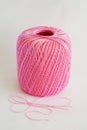 Ball of pink yarn, on white background. Royalty Free Stock Photo