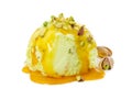 Ball pistachio ice cream with pistachios and caramel syrup isolated on white