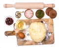 Ball of pizza dough on wooden kitchen cutting board with dusting of flour Royalty Free Stock Photo