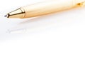 Ball-point pen from steel of yellow color. Objects on a white background Royalty Free Stock Photo