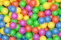 Ball pool or pit filled with red, green, yellow,pink and blue plastic balls, abstract texture background top view flat lay from Royalty Free Stock Photo
