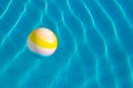 Ball pool side floating on water background surface summer time bright day vacation season concept wallpaper pattern picture with Royalty Free Stock Photo