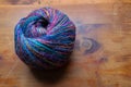 Ball skein of yarn in beautiful shades of blue, magenta, and yellow, needlework craft, theme, creative copy space