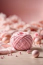 Ball of soft pink yarn lies on pink surface. Generative AI. Royalty Free Stock Photo