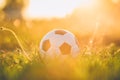 A ball for street soccer football under the sunset ray light. Film picture style.