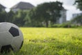 A ball for street soccer football under the sunset ray light in grass field area with abstract lights blurred bokeh copy space Royalty Free Stock Photo