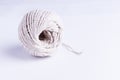 Ball of string on white background