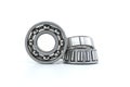 Ball and tapered roller bearing on white background