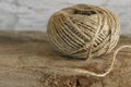 Ball of twine on a wooden background