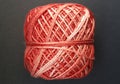 Ball of woll. Beautiful red and white color. Ready for knitting or scrotching! Royalty Free Stock Photo