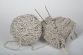 Ball of wool with spokes for handmade knitting on wooden table. Knitting wool and knitting needles. Royalty Free Stock Photo