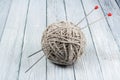 Ball of wool with spokes for handmade knitting on wooden table. Knitting wool and knitting needles Royalty Free Stock Photo