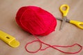 Ball of yarn. A ball of red thread. A ball of thread and scissors. Edge cotton threads Royalty Free Stock Photo