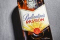 Ballantines passion spirit drink on stone slate background.