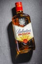 Ballantines passion spirit drink on stone slate background. Royalty Free Stock Photo