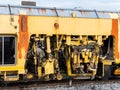 The ballast tamping machine is working to maintain the sleeper and ballast stone