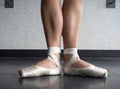 Ballerina in Ballet first position in ballet pointe shoes and bare legs Royalty Free Stock Photo