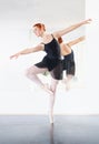 Ballerina, ballet and woman is dancing in class, young dancer in rehearsal with art and grace at studio. Female person