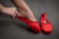 Ballerina dancer wearing red pallet pointe slippers Royalty Free Stock Photo
