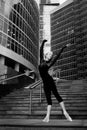 Ballet dancer on city street background. Artistic. Black and white. Royalty Free Stock Photo