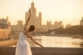 Ballerina dancing in classical white costume