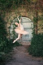 Ballerina dancing outdoors classic ballet poses in urban background Royalty Free Stock Photo